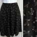 Vintage 90s black Floral mini skater Skirt sz Small / 28 Waist