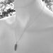 Three peas in a pod, green mother of pearl peapod pendant necklace on sterling silver chain.