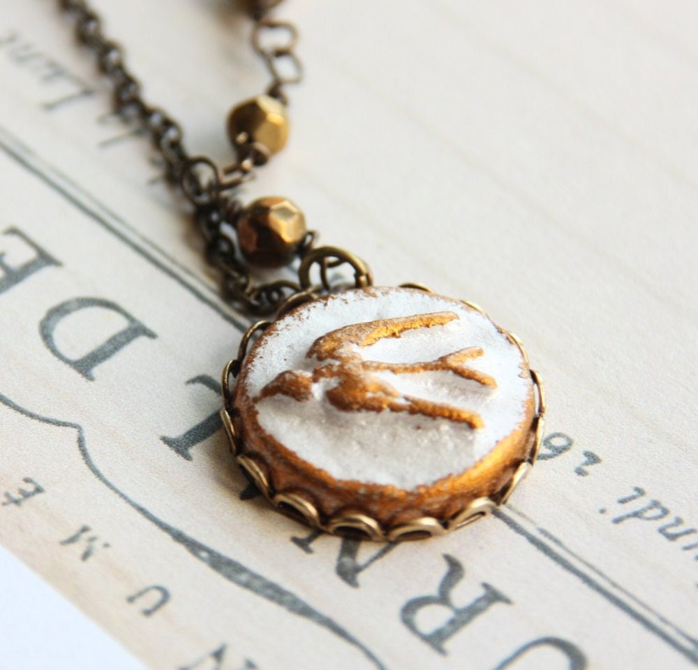 Fly Away Necklace - White Pearl and gold swallow bird clay pendant in lace edge setting on delicate antique brass chain