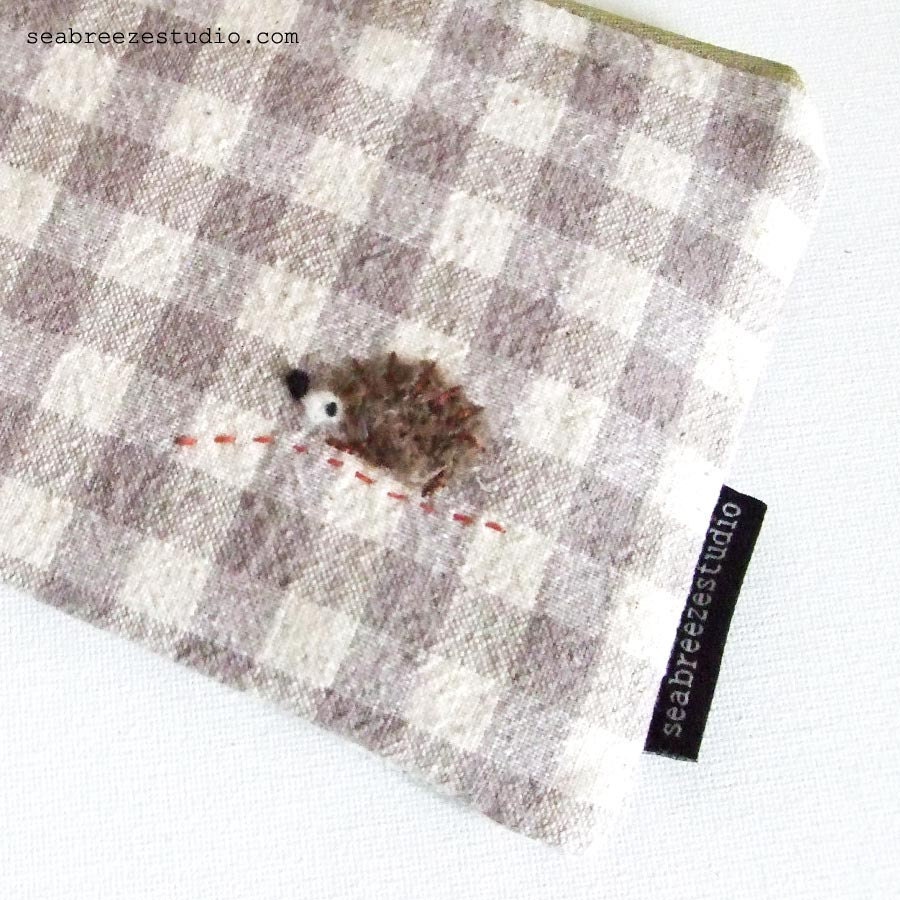 Zipper pouch/pencil case -grey gingham with a hedgehog appliqué