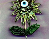 HANDMADE JEWELRY BROOCH...Eye Blossom....dramatic handmade brooch with a protective eye charm..good luck brooch.