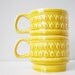 Two vintage cups stacking ceramic raindrop pattern - caramel yellow mugs with rain drops