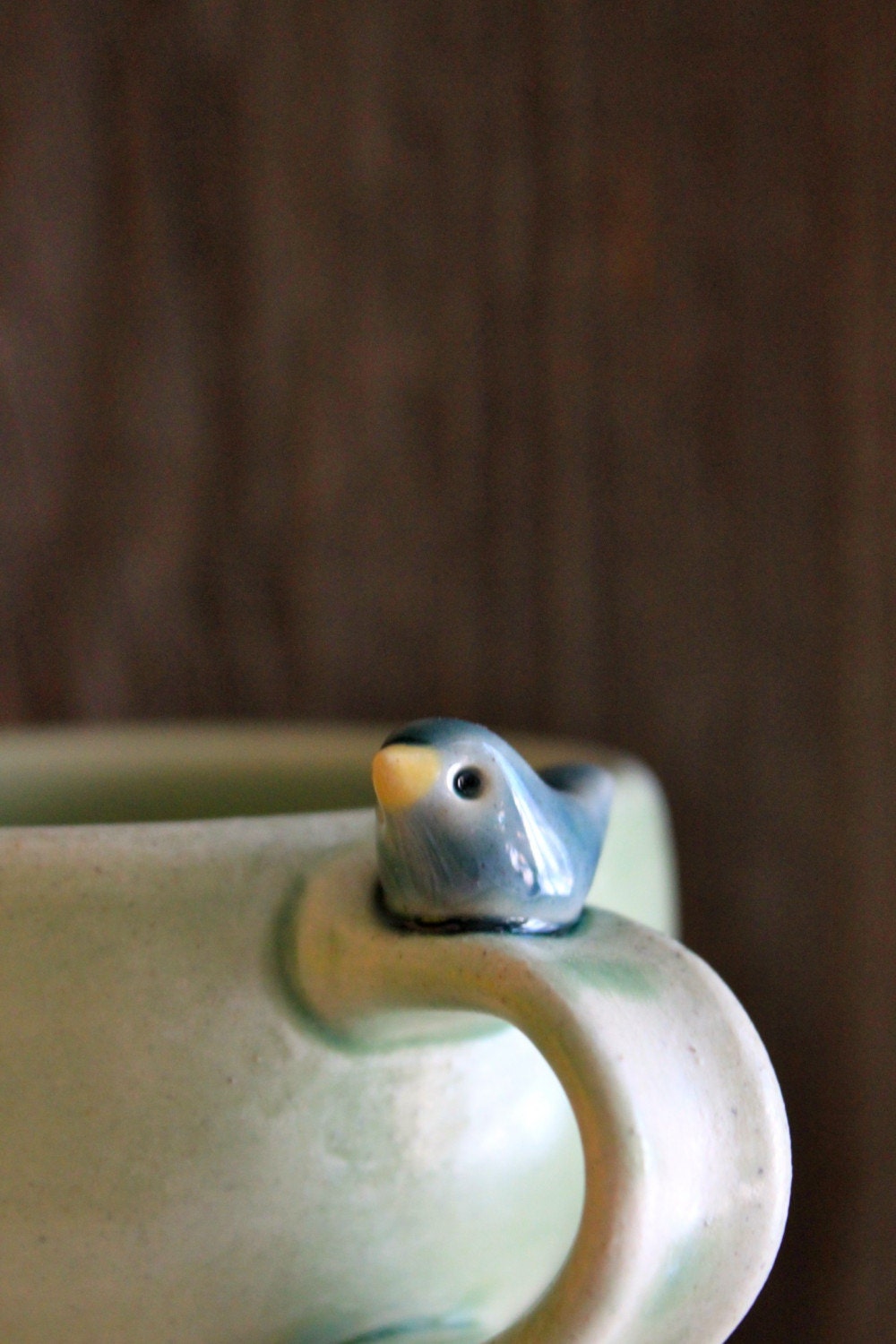 Sweet Little Blue Bird on a Pale Green Cup