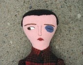 boy with black eye doll