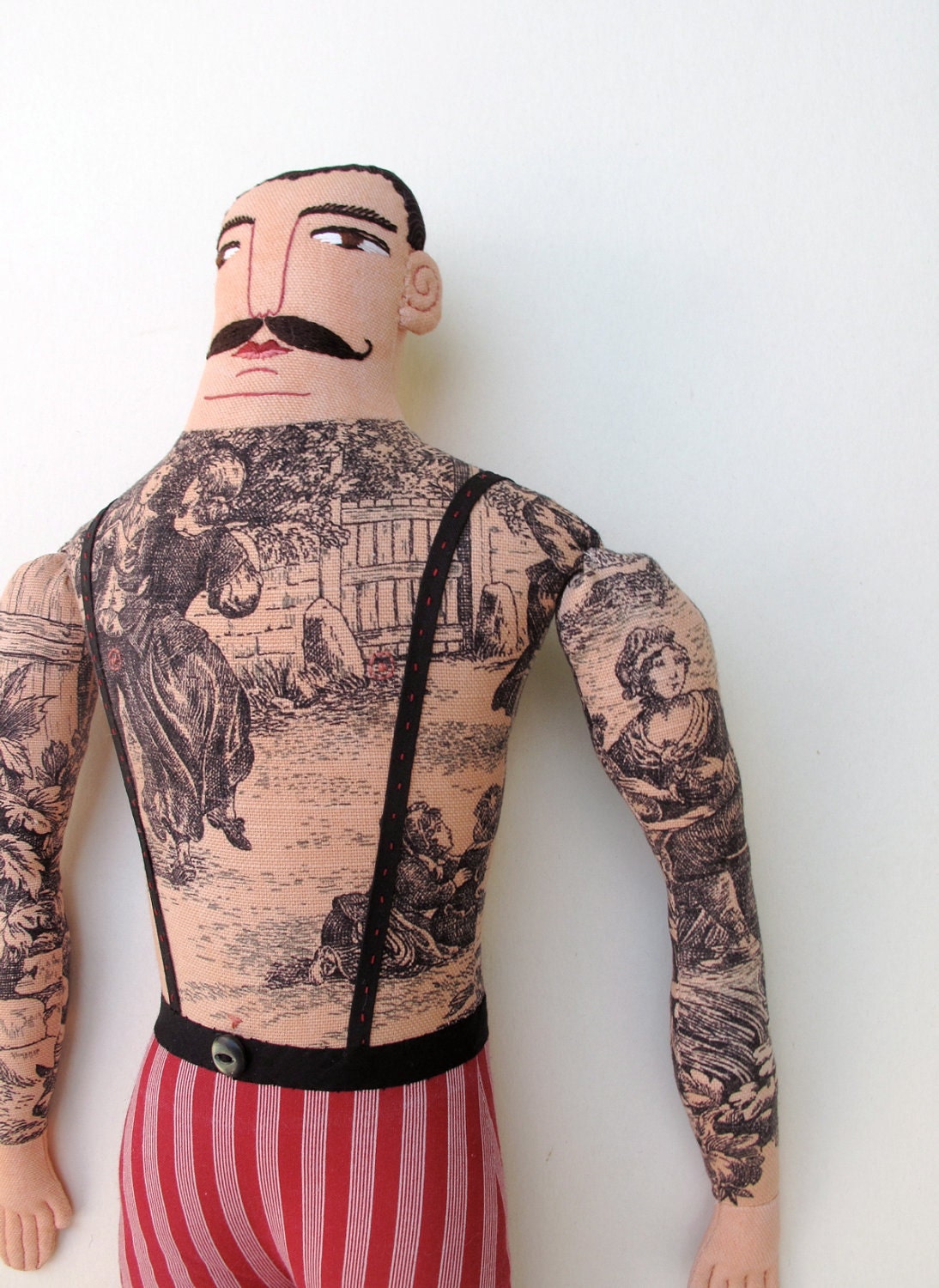 tattooed man doll