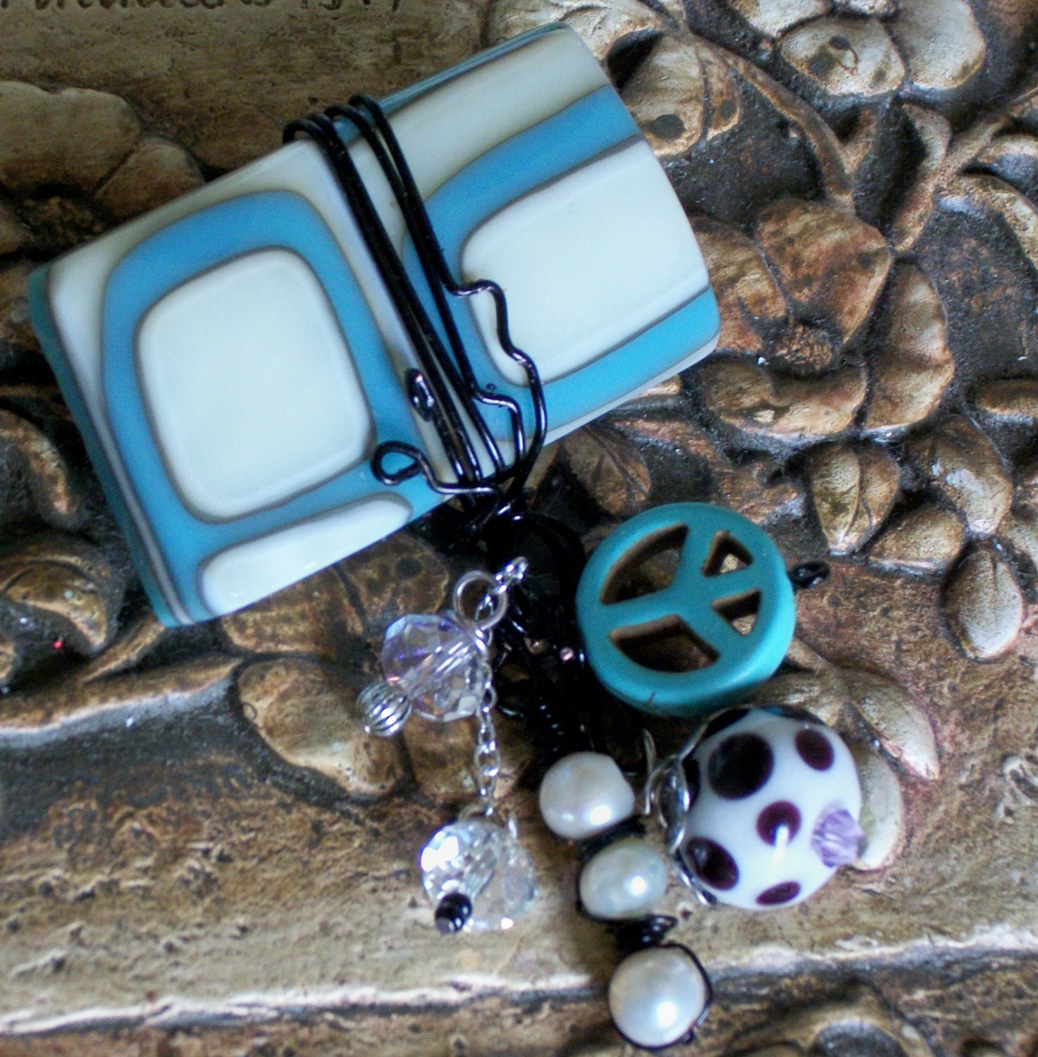 fused glass brooch with charm accents peace retro