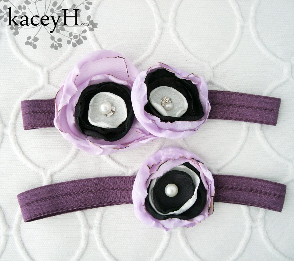 Vibrant wedding garter set in shimmery eggplant purple with lilac flowers, Swarovski crystals and pearls.  Ready to ship.
