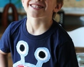 Blue Bernard monster on Navy Tee sizes 2, 4, 6, 8, 10, 12
