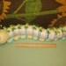 Learn to make a DIAPER CATERPILLAR from diapers and such. GR8 Baby Shower Gift.