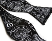 Apollo Cockpit men's bow tie, freestyle. Silkscreened black necktie, white ink.