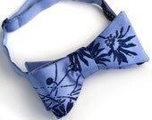 Lazy Daisy blue bow tie. Periwinkle and blue violet freestyle tie. Silkscreened floral necktie.