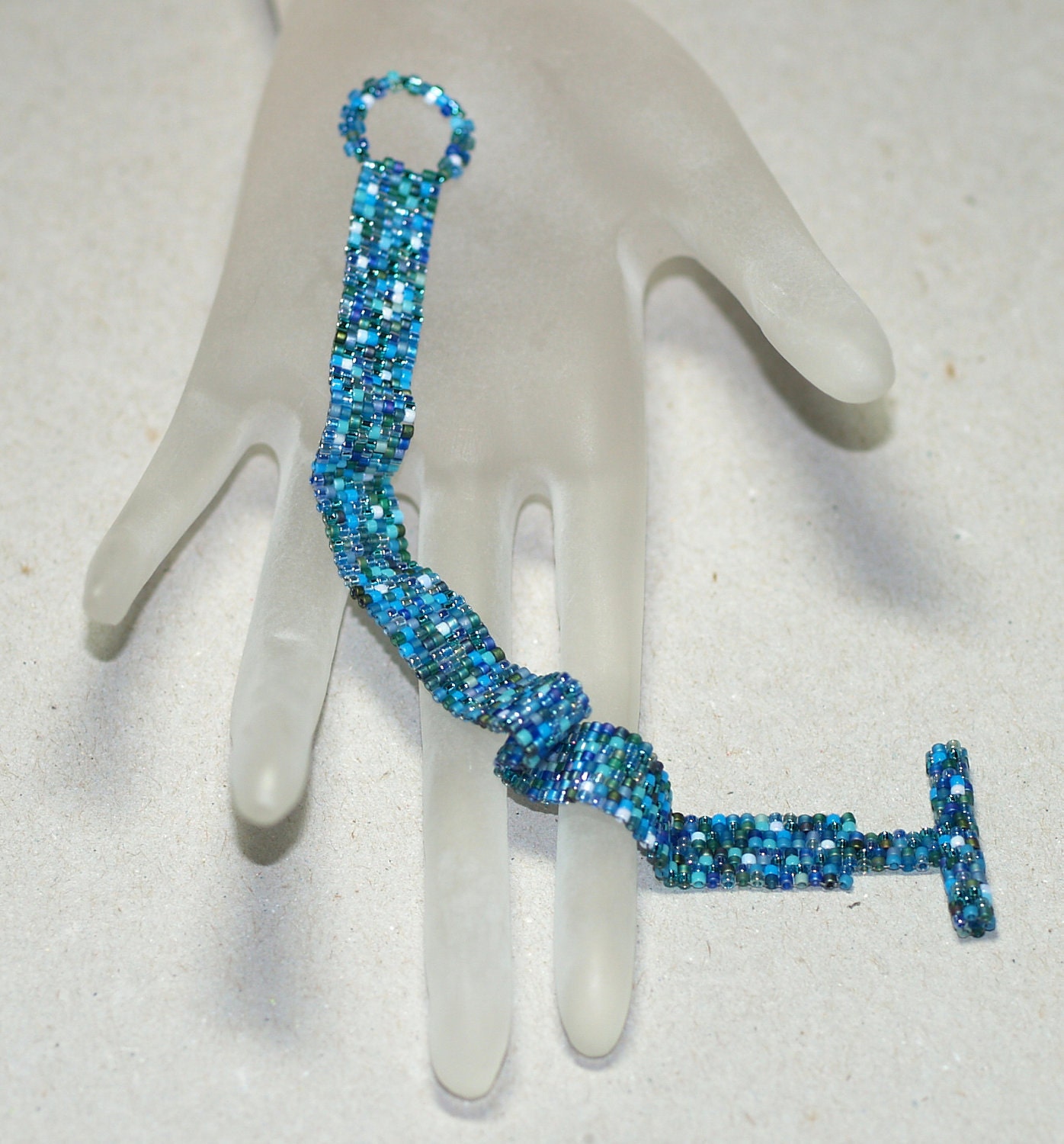 Teal ... Peyote Bracelet . Narrow . Shiny . Shades of Blue . Aqua . Turquoise . Green . Oceanic . Simple . Modern . Elegant . Chic