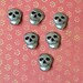 Metal skull buttons
