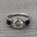 Moissanite, Chatham Blue Sapphire, and Recycled 14k White Gold Three-Stone Wedding or Engagement Ring - Eco-Friendly Diamond Alternative
