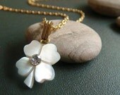 four leaf clover . mother of pearl charm necklace .