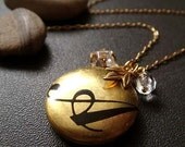 her name is . . . custom initial locket necklace .