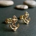 anchor's away . gold . anchor stud earrings