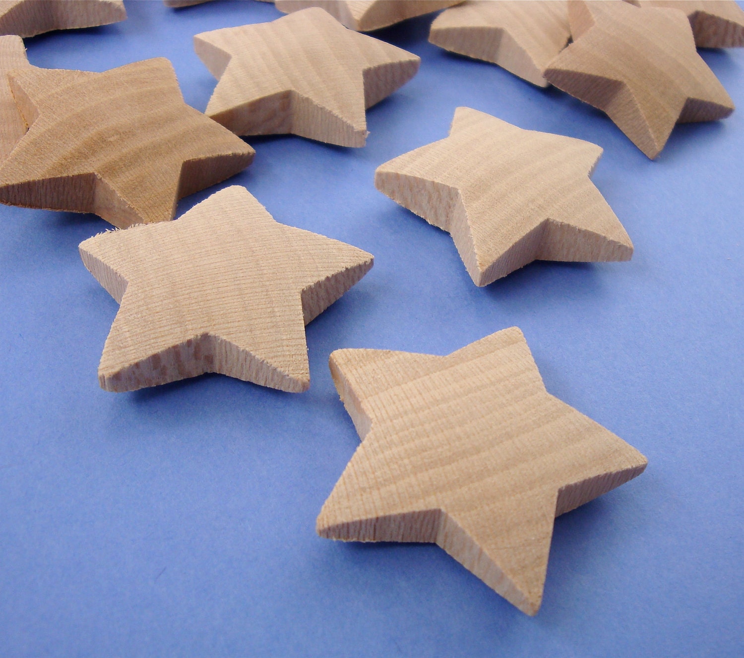 12 wood stars . sculptured dimensional . 1 3/8" size