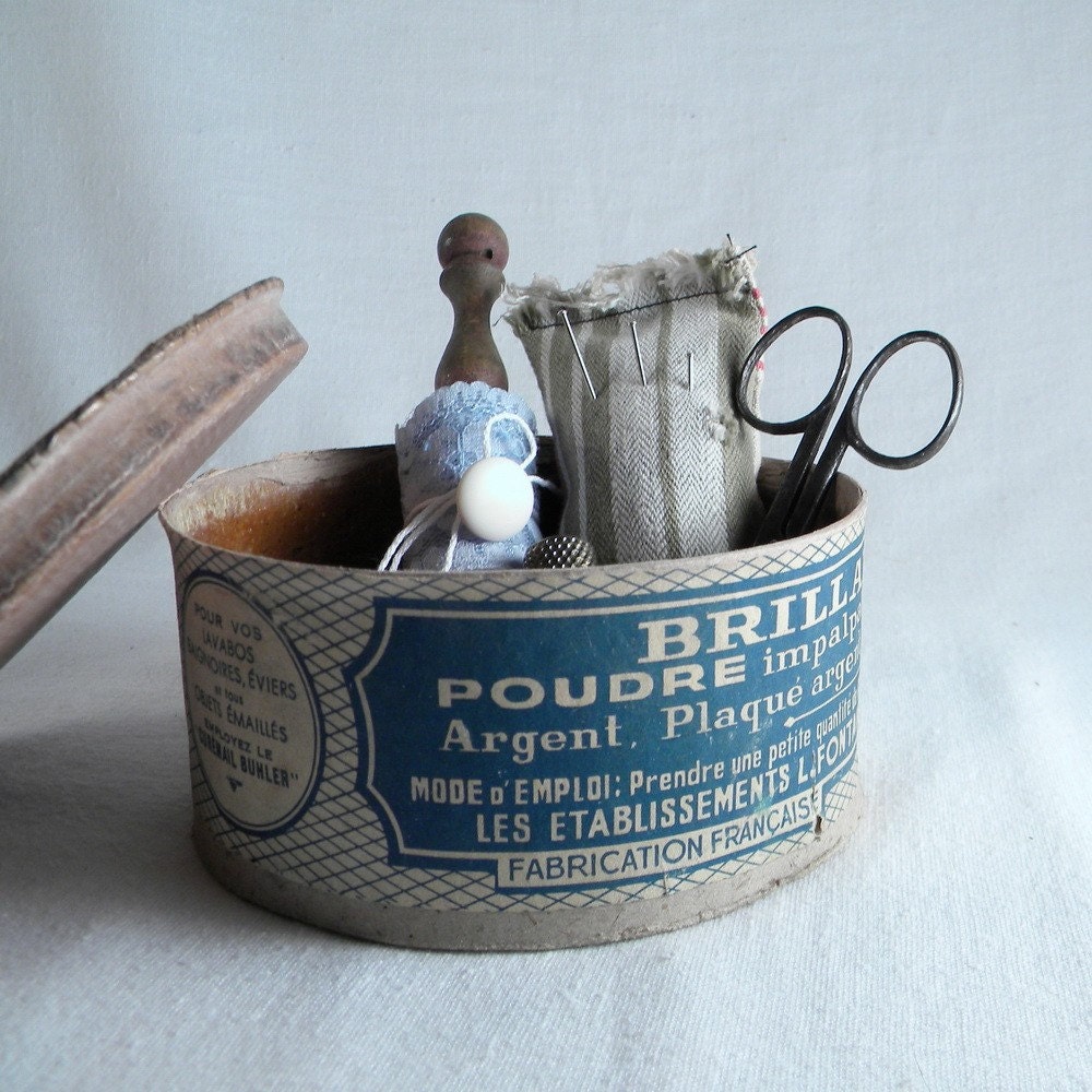 Vintage sewing kit with scissors, lace, lace bobbin, buttons, tin box, pincushion, thimble