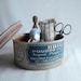 Vintage sewing kit with scissors, lace, lace bobbin, buttons, tin box, pincushion, thimble