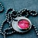 X. Pendant on a Chain.