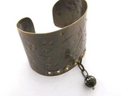 Metal stylish extra wide cuff  brass bracelet with rhinestone  charm. Will fit large wrist. Design in Fashion Brand Faina studio.