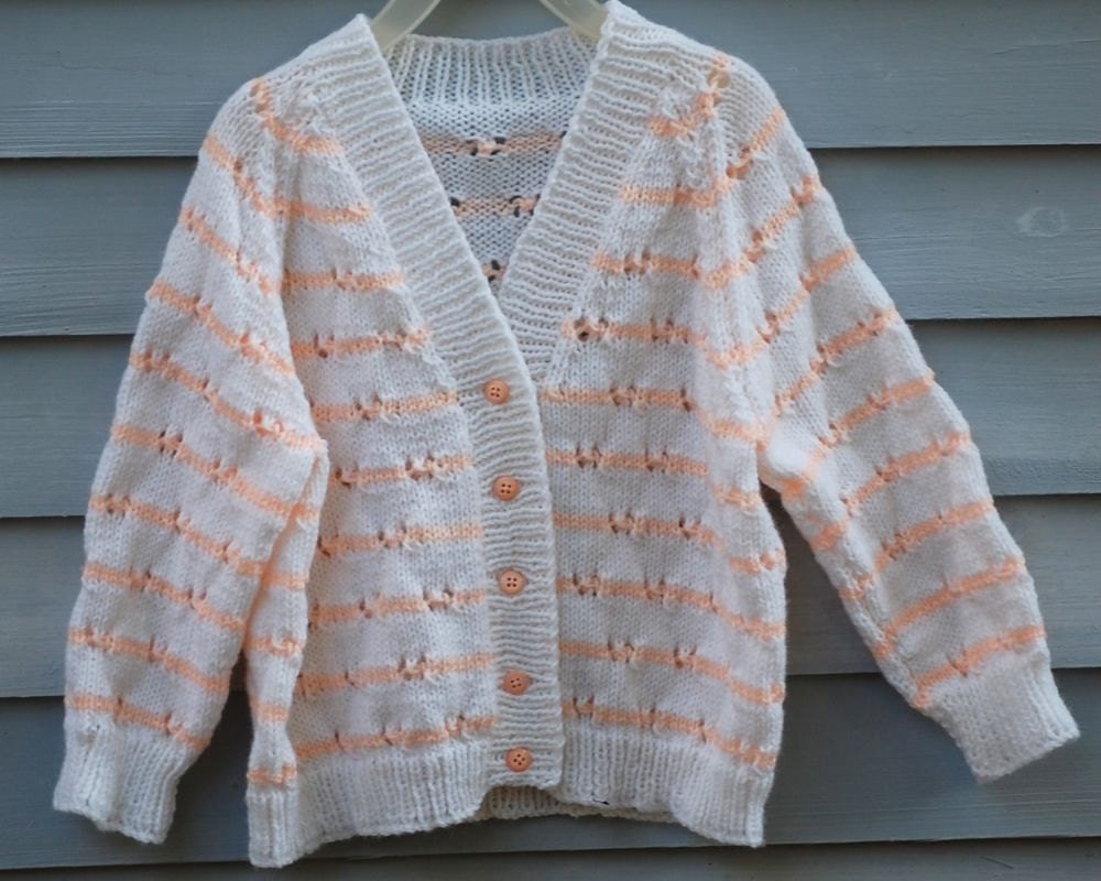 Girl, size 2/3,White cardigan with peach stripes.