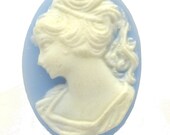 Blue Cameo Ring on adjustable silver band in purple ring box