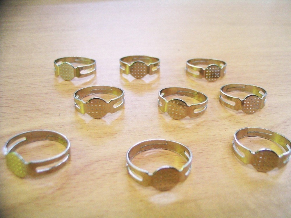100 pcs of steel tone adjustable ring pad blank findings