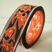 art nouveau jacquard ribbon in amber and jet black 1" wide