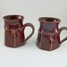 impossibly awesome pair of red mugs