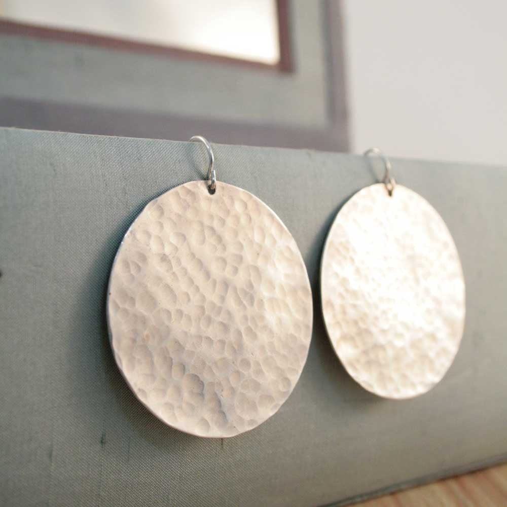 extra large disc earrings.