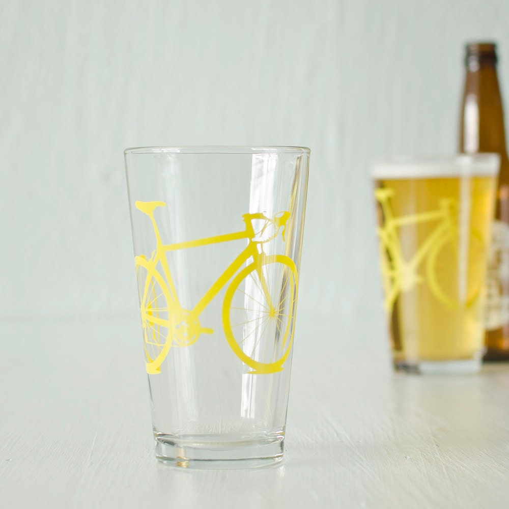 2 bicycle pint glasses, yellow bike