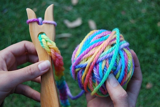 wooden knitting fork with hand painted rainbow wool