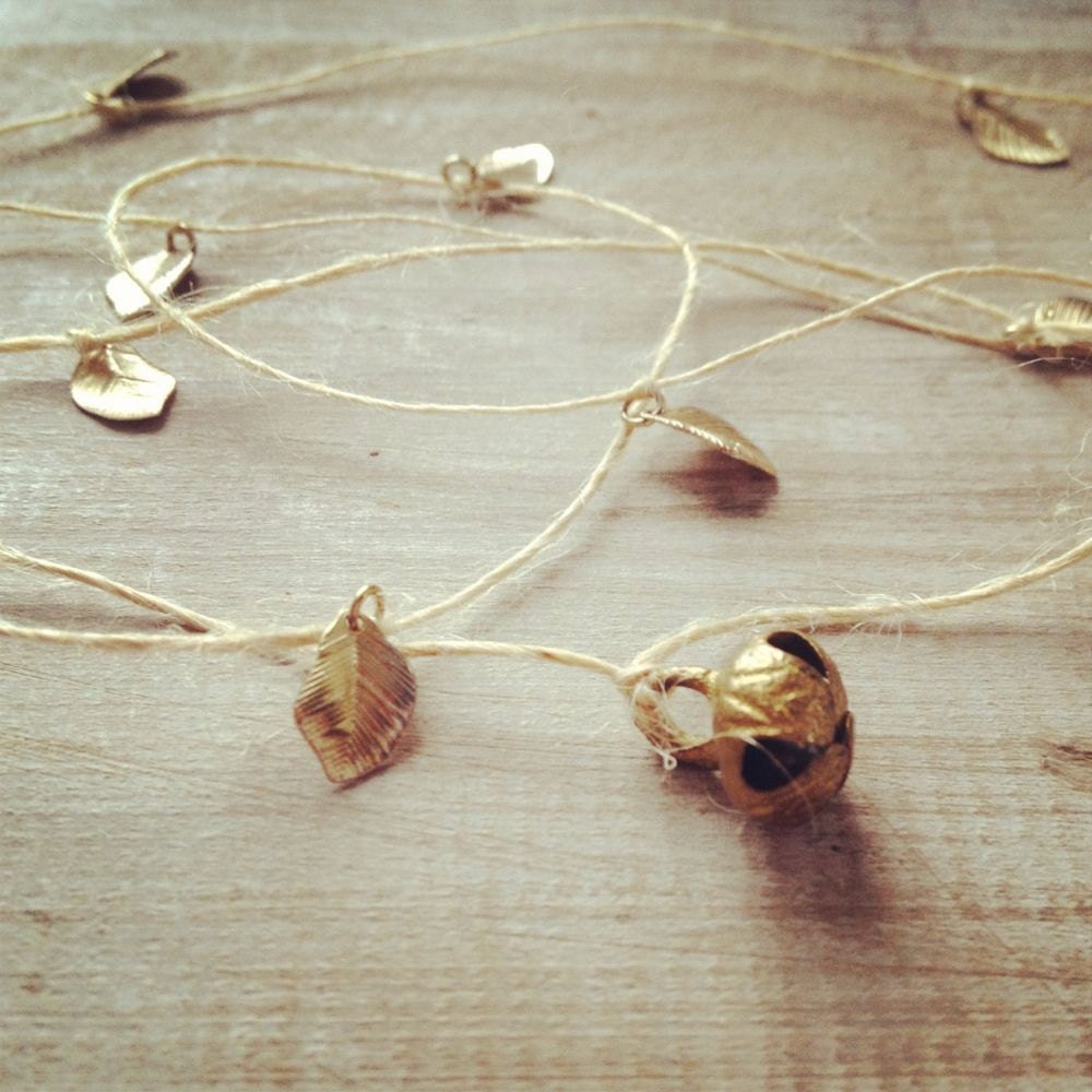 SALE Altered vintage matchbox with a delicate gold bell and leaves garland inside