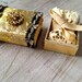 SALE Altered vintage matchbox with a delicate gold bell and leaves garland inside