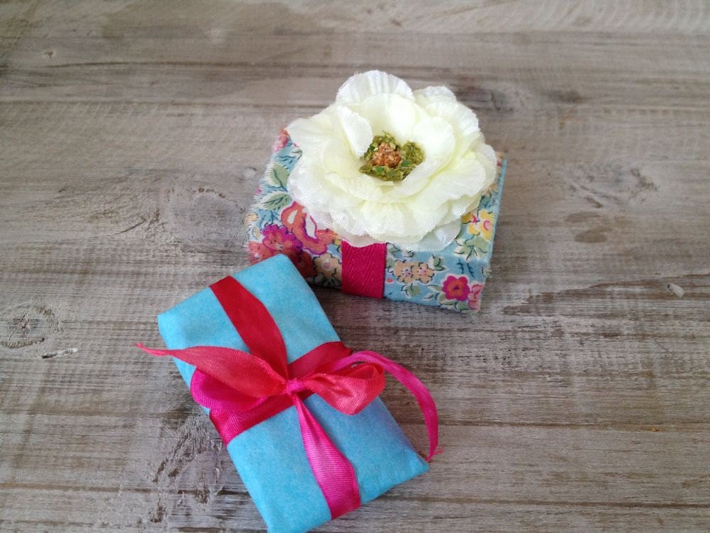 Altered vintage matchbox with a handmade rose and liberty fabric pendant inside