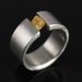 raw diamond tension set in stainless steel. ring