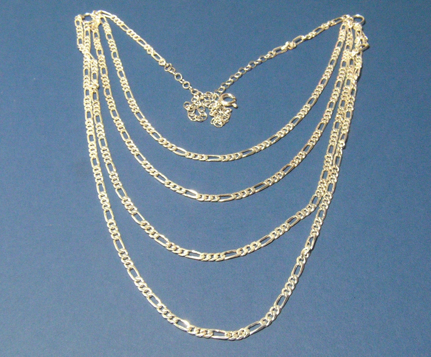 Sterling Elegance a 4 strand Figaro adjustable Sterling silver chain necklace