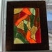 Swirling in from the outside a stained glass panel