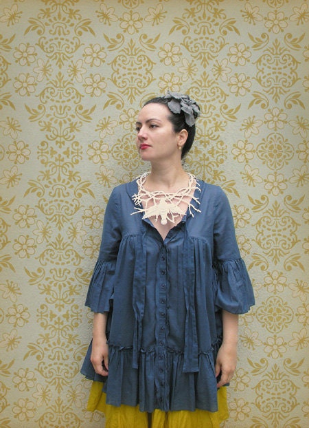 Frida Kahlo inspired necklace made out of acid-free paper. Suitable for framing in a shadow box.