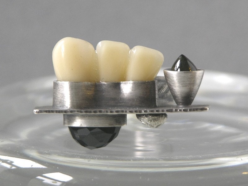 Three Teeth In A Row Ring Made With Fake Teeth