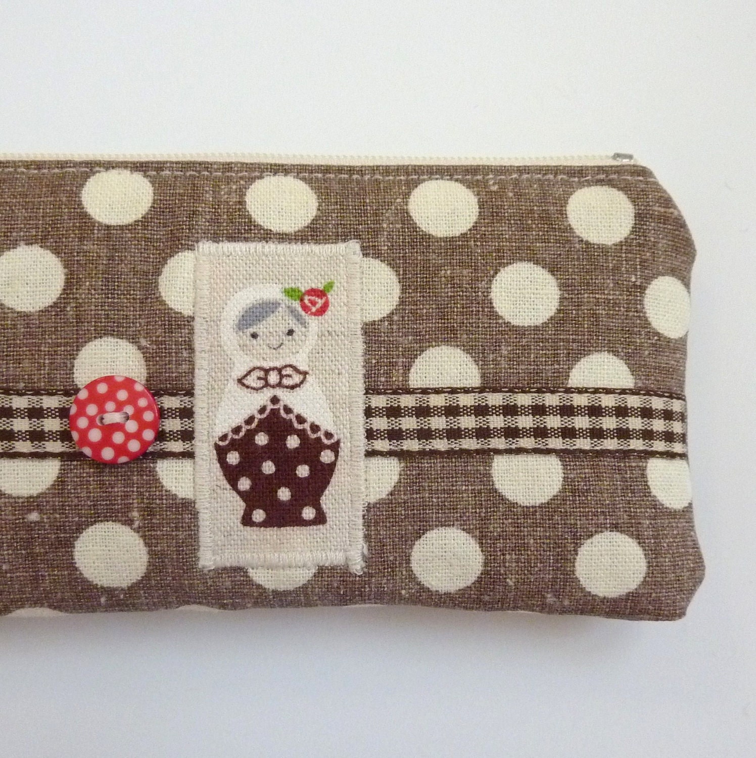 Coffee and cream polka dot pencil case with Russian doll motif