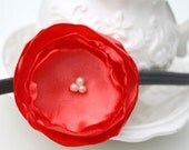 Bright coral orange burnt edge fabric flower  with glass pearls on black headband by the Paisley Moon on Etsy