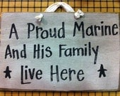 A proud MARINE and his family live here wood sign personalize or custom available soldier sailor