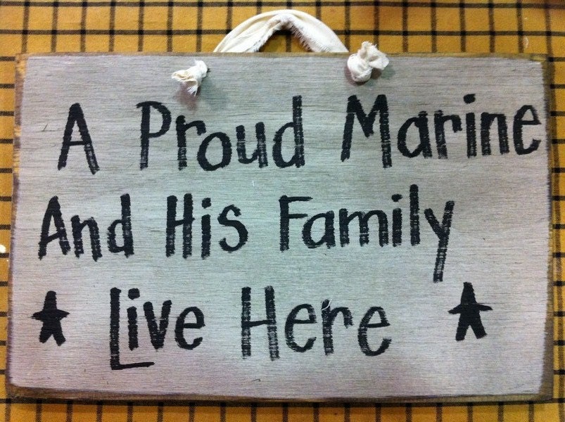 A proud MARINE and his family live here wood sign personalize or custom available soldier sailor