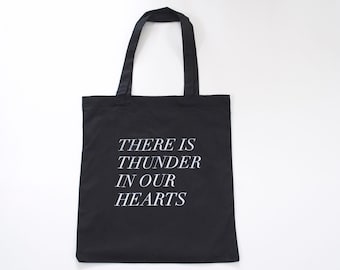 thunder in our hearts tote in black