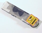 Key Chain Cream with a Grey Floral Pattern