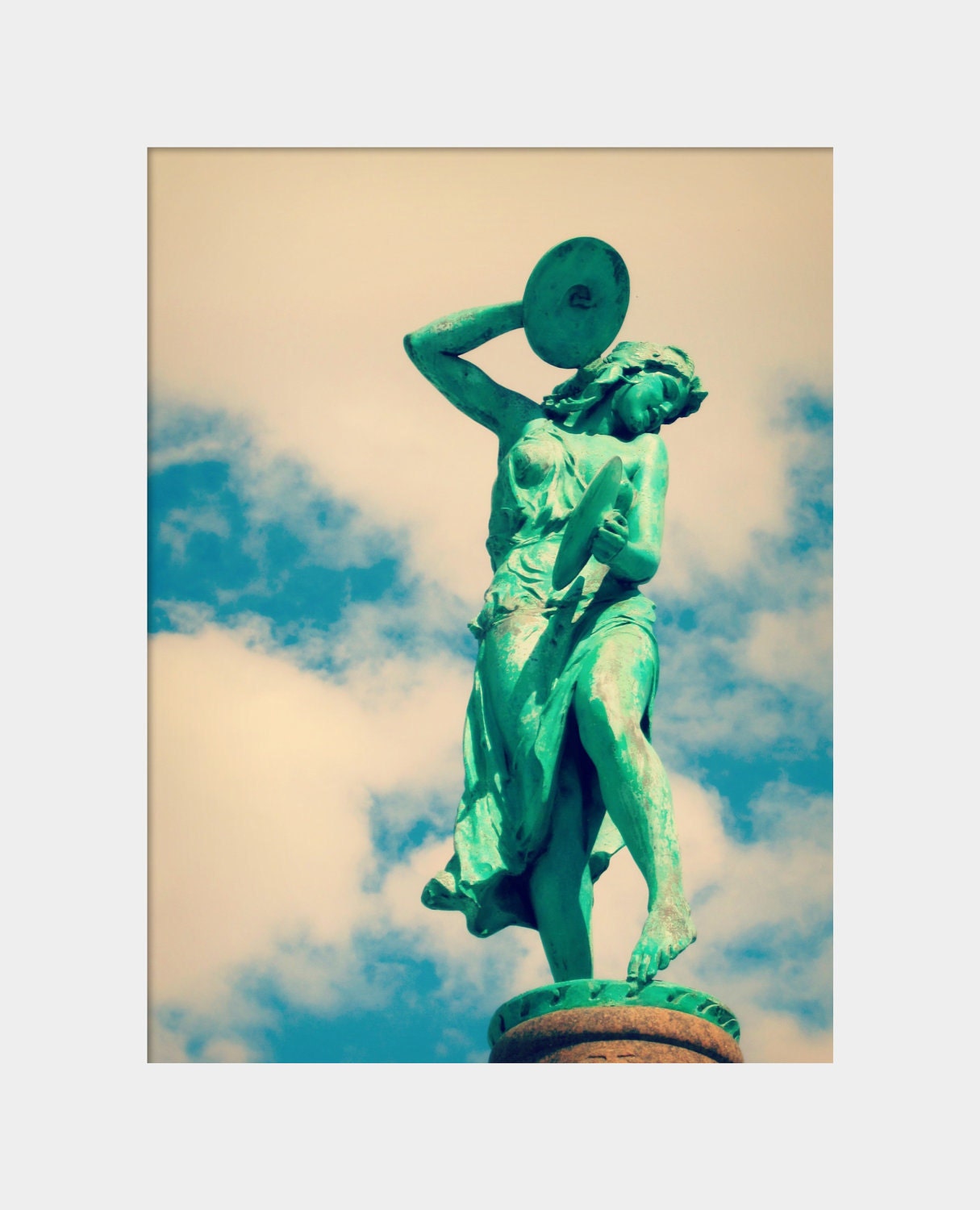 Cymbal Player: fine art photograph print of a green statue of a woman playing music against the blue sky with clouds (Indianapolis)