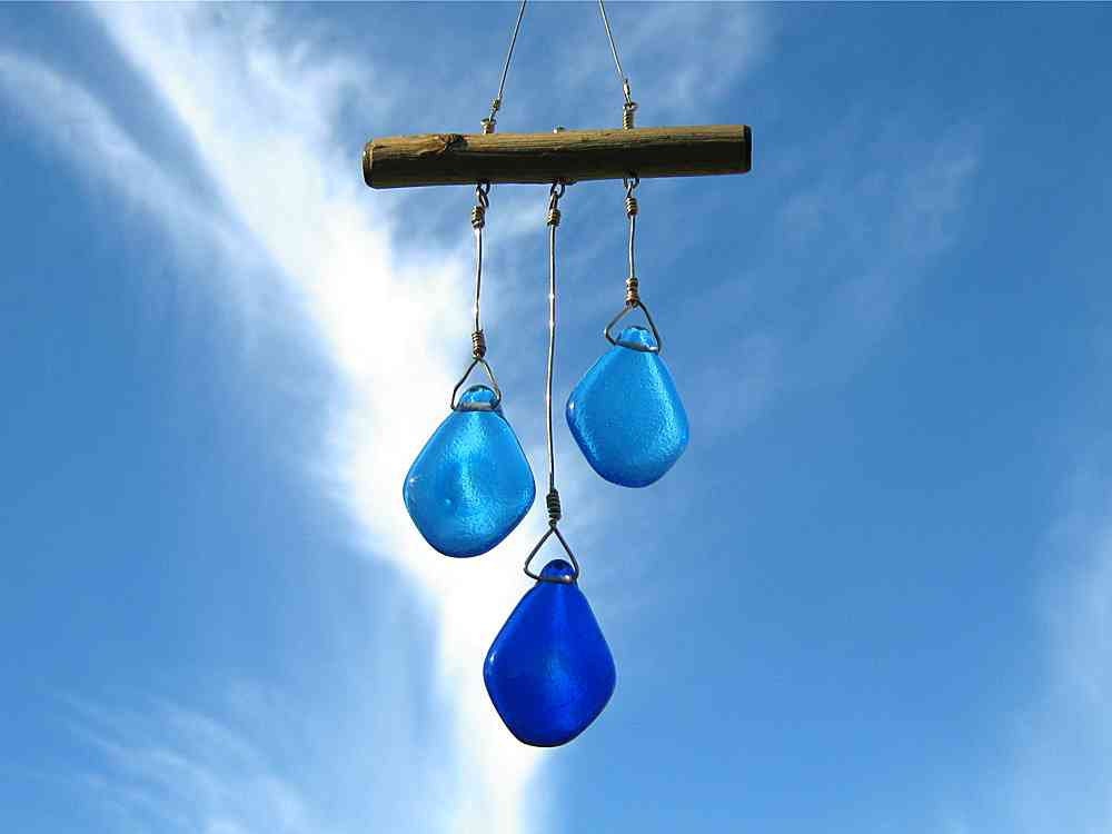 Three Glass Droplets in Blue Glass on a Twig